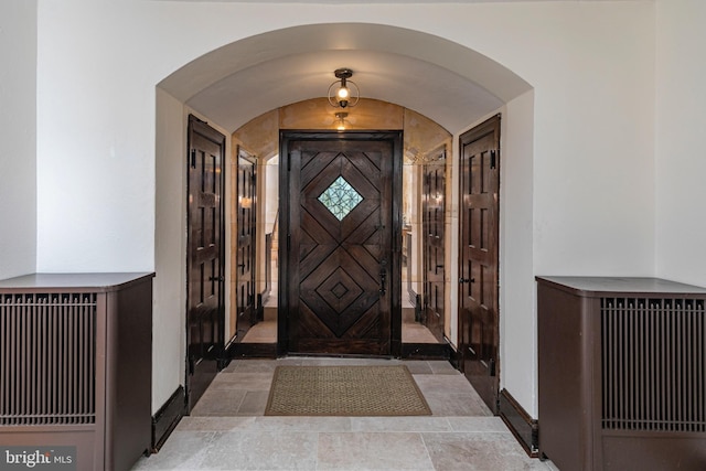722 River Rd, Ewing, NJ 08628 - entryway featuring arched walkways and light stone finish flooring