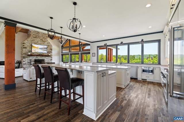 1 Cross County Rd, Mineral, VA 23117 - kitchen featuring open floor plan, a spacious island, ornamental molding, white cabinetry, and dark wood-style flooring