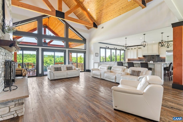 1 Cross County Rd, Mineral, VA 23117 - living area with a chandelier, high vaulted ceiling, a wooden ceiling with exposed beams, a stone fireplace, and dark wood finished floors