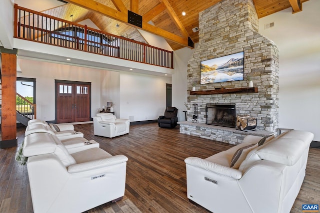 1 Cross County Rd, Mineral, VA 23117 - living area with high vaulted ceiling, a wooden ceiling with exposed beams, a stone fireplace, stairs, and hardwood / wood-style floors