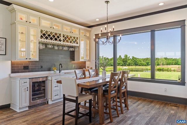 1 Cross County Rd, Mineral, VA 23117 - dining area with bar with sink, wine cooler, dark wood finished floors, recessed lighting, and a chandelier