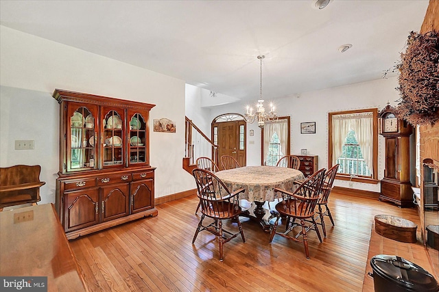 59 Segovia Ct, Hanover, PA 17331 - dining area with light wood-style floors, a chandelier, and stairway