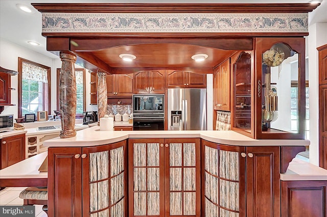 59 Segovia Ct, Hanover, PA 17331 - kitchen with appliances with stainless steel finishes, decorative columns, light countertops, brown cabinets, and recessed lighting