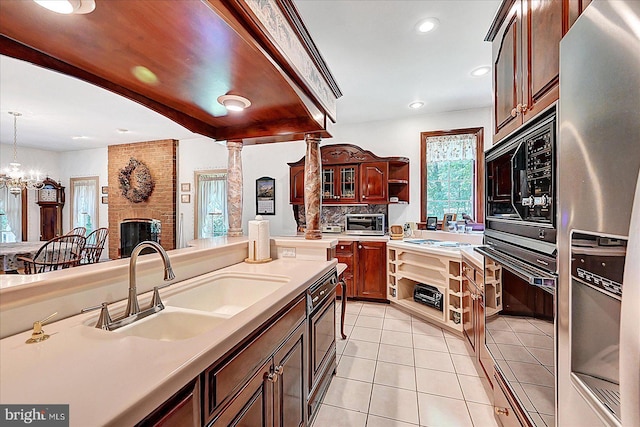 59 Segovia Ct, Hanover, PA 17331 - kitchen featuring stainless steel refrigerator with ice dispenser, oven, open shelves, light tile patterned flooring, and light countertops