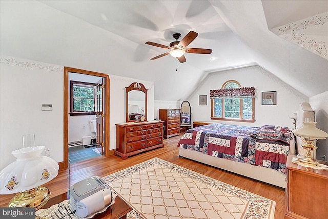 59 Segovia Ct, Hanover, PA 17331 - bedroom with multiple windows, light wood finished floors, lofted ceiling, a baseboard heating unit, and a ceiling fan
