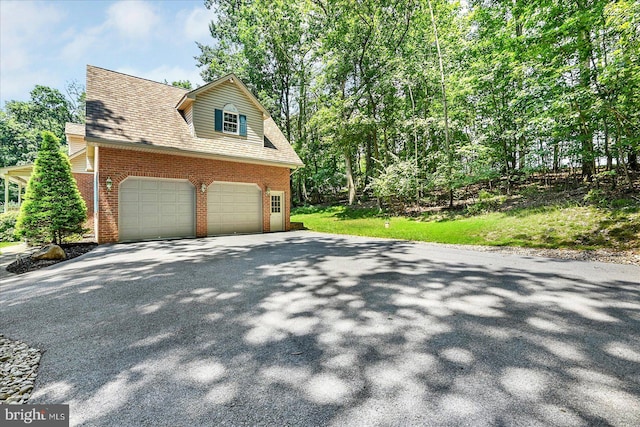 59 Segovia Ct, Hanover, PA 17331 - view of home's exterior with brick siding, asphalt driveway, and an attached garage