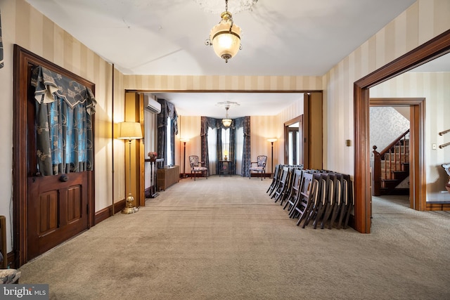 2505-2507 High St, Port Norris, NJ 08349 - hallway featuring wallpapered walls, light carpet, stairway, a wall mounted AC, and a chandelier