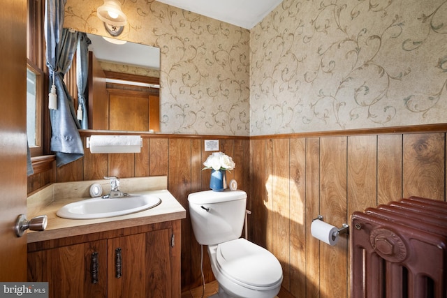 2505-2507 High St, Port Norris, NJ 08349 - half bath featuring radiator, vanity, wainscoting, and wallpapered walls