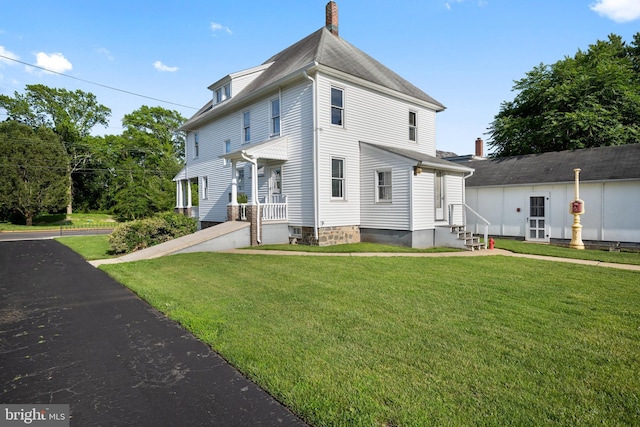 2505-2507 High St, Port Norris, NJ 08349 - view of front of property with entry steps, a front lawn, and a chimney