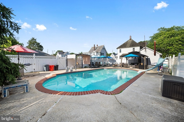 2505-2507 High St, Port Norris, NJ 08349 - view of swimming pool with a gazebo, a water slide, a patio area, a fenced backyard, and a gate