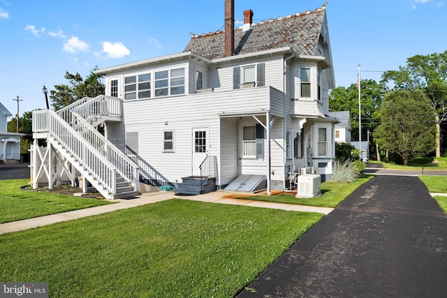 2505-2507 High St, Port Norris, NJ 08349 - back of house with a chimney, a lawn, and a deck