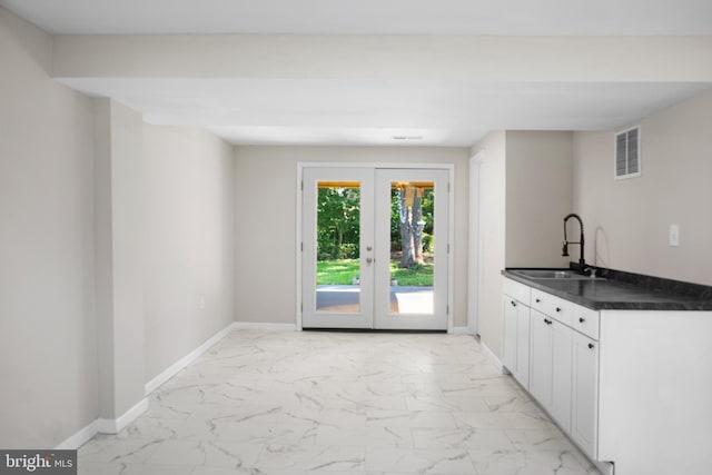 1614 Maryland Ave, Woodbridge, VA 22191 - bar area with light marble finish floors and french doors