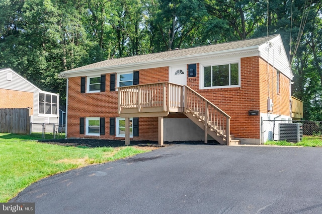1614 Maryland Ave, Woodbridge, VA 22191 - view of front of house with brick siding and view of wooded area