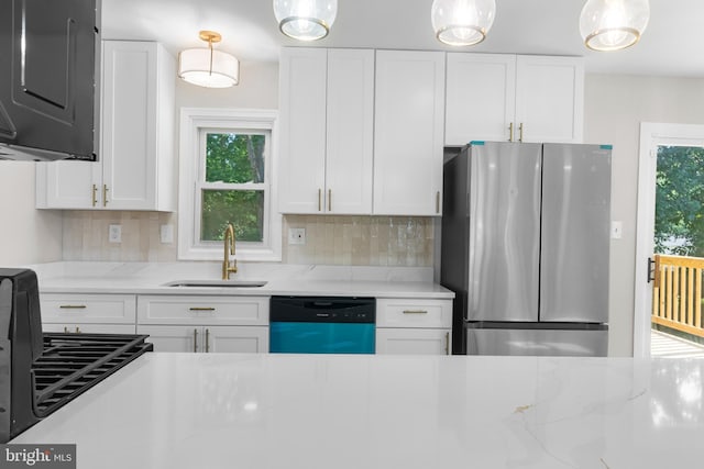 1614 Maryland Ave, Woodbridge, VA 22191 - kitchen featuring freestanding refrigerator, dishwashing machine, white cabinetry, and plenty of natural light