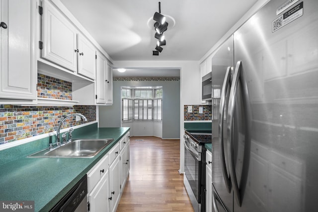 1804 Aberdeen Cir, Crofton, MD 21114 - kitchen featuring appliances with stainless steel finishes, light wood finished floors, white cabinets, and tasteful backsplash