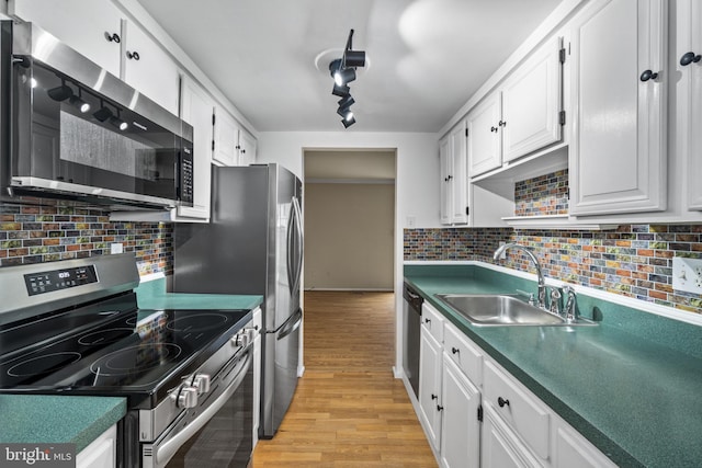 1804 Aberdeen Cir, Crofton, MD 21114 - kitchen featuring appliances with stainless steel finishes, light wood-style floors, white cabinets, tasteful backsplash, and dark countertops