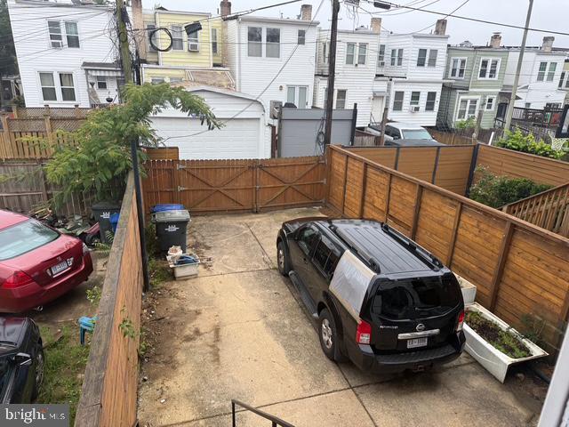 812 Emerson St NW, Washington, DC 20011 - view of parking / parking lot featuring a residential view and a gate