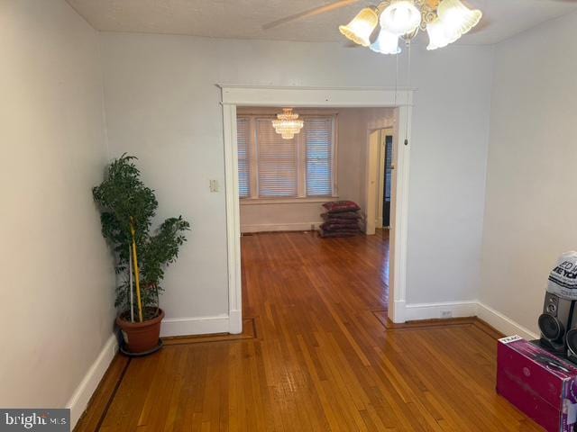 812 Emerson St NW, Washington, DC 20011 - hallway with a chandelier and wood finished floors