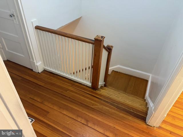812 Emerson St NW, Washington, DC 20011 - staircase with wood finished floors and baseboards