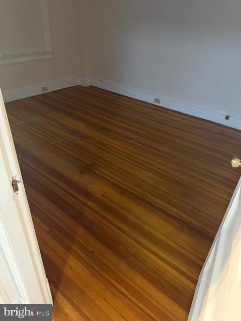 812 Emerson St NW, Washington, DC 20011 - empty room featuring wood finished floors and baseboards
