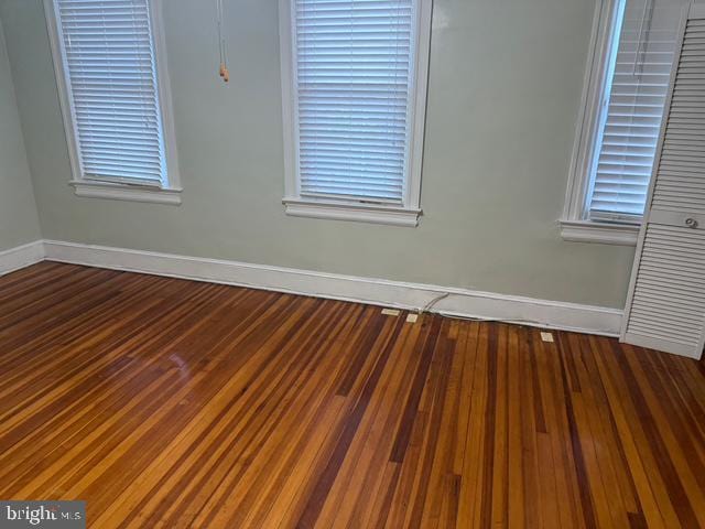 812 Emerson St NW, Washington, DC 20011 - spare room with baseboards and wood finished floors
