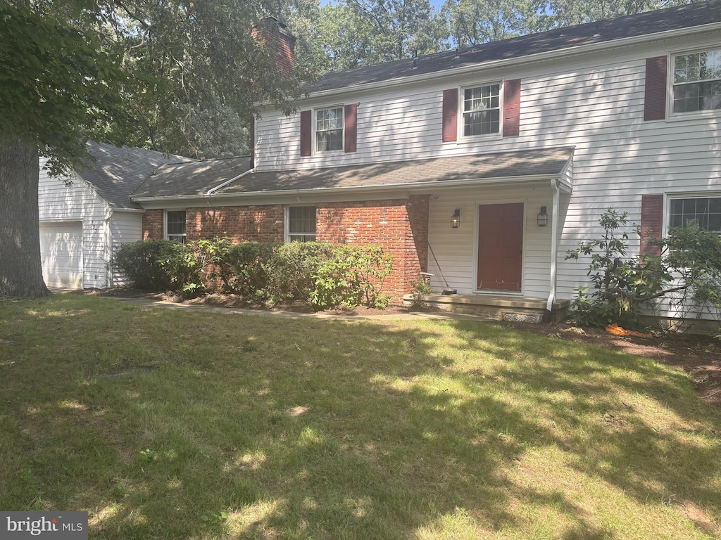 153 Drexel Dr, Severna Park, MD 21146 - traditional home featuring a chimney and a front yard