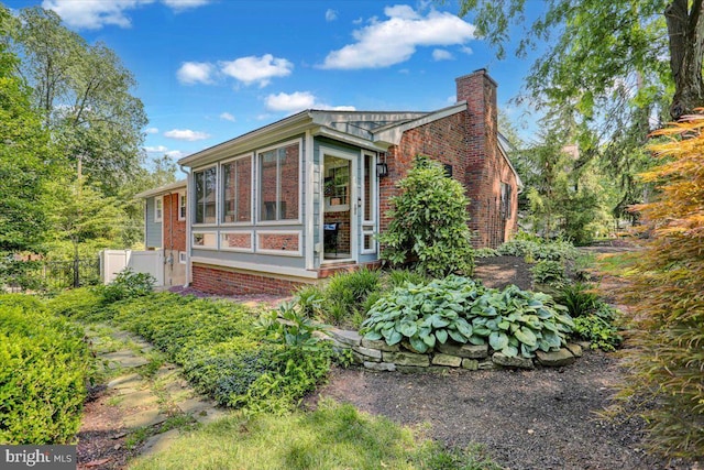 109 Wyomissing Blvd, Wyomissing, PA 19610 - view of home's exterior with a chimney and brick siding