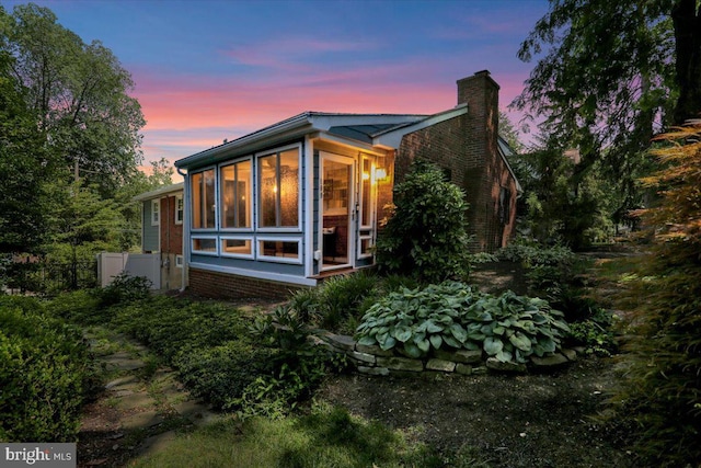 109 Wyomissing Blvd, Wyomissing, PA 19610 - back of house at dusk with a chimney