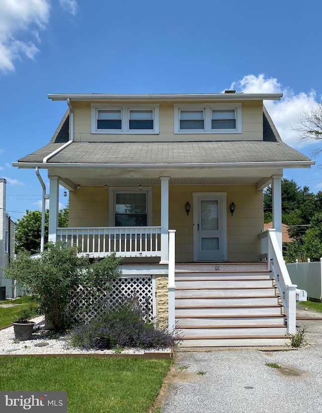 10 Hawthorne Ave, Pikesville, MD 21208 - bungalow-style home with covered porch, a shingled roof, and stairway