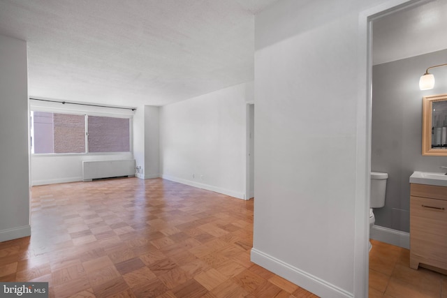 4515 Willard Ave Unit 915S, Chevy Chase, MD 20815 - spare room featuring radiator heating unit and baseboards