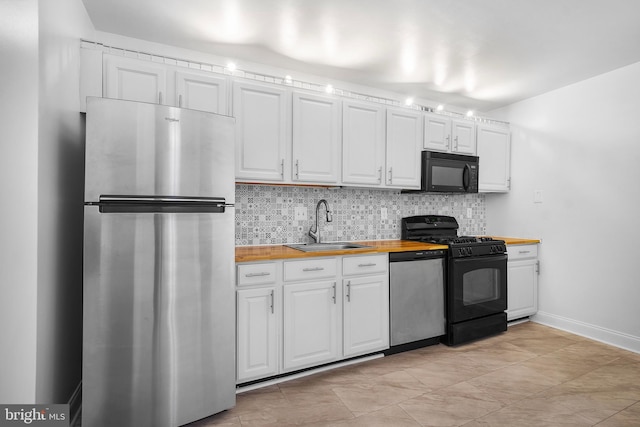 4515 Willard Ave Unit 915S, Chevy Chase, MD 20815 - kitchen featuring black appliances, butcher block counters, tasteful backsplash, and white cabinetry