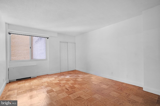 4515 Willard Ave Unit 915S, Chevy Chase, MD 20815 - unfurnished room with baseboards and radiator