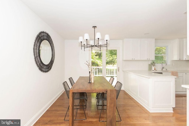 19023 Staleybridge Rd, Germantown, MD 20876 - dining space with a chandelier and light wood-style floors
