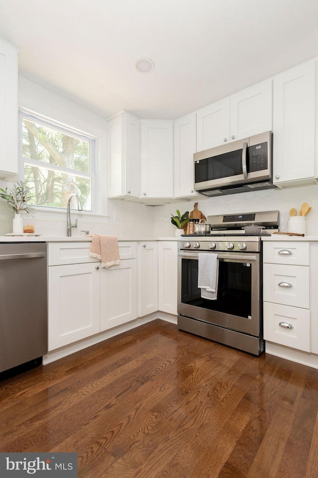 19023 Staleybridge Rd, Germantown, MD 20876 - kitchen featuring stainless steel appliances, light countertops, and white cabinetry