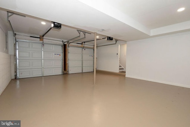 19023 Staleybridge Rd, Germantown, MD 20876 - garage featuring a garage door opener and recessed lighting