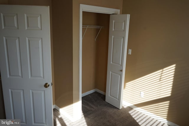 324 W 29th St, Baltimore, MD 21211 - unfurnished bedroom featuring a closet and dark colored carpet
