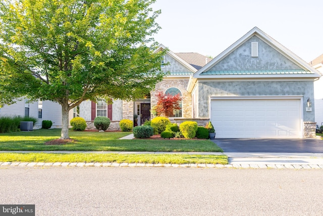 39 Mission Way, Barnegat, NJ 08005 - view of front of home with stone siding, asphalt driveway, a front yard, stucco siding, and a garage