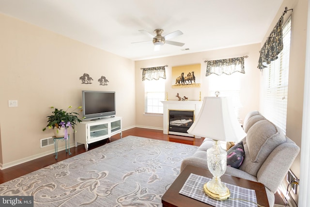39 Mission Way, Barnegat, NJ 08005 - living room featuring wood finished floors, a ceiling fan, and a glass covered fireplace