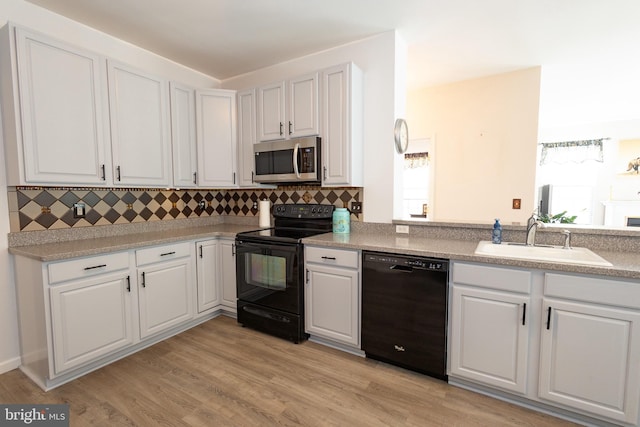 39 Mission Way, Barnegat, NJ 08005 - kitchen featuring black appliances, backsplash, and white cabinetry