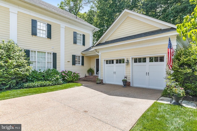 2819 Live Oak Ln, Midlothian, VA 23113 - view of front facade with concrete driveway, an attached garage, and a shingled roof