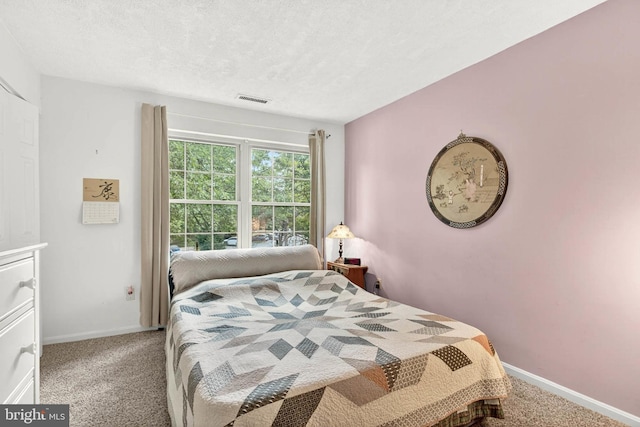 16 Rainflower Path Unit 204, Sparks Glencoe, MD 21152 - bedroom featuring carpet flooring and a textured ceiling