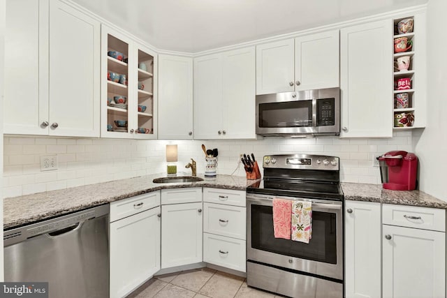 16 Rainflower Path Unit 204, Sparks Glencoe, MD 21152 - kitchen featuring appliances with stainless steel finishes, open shelves, white cabinets, and backsplash