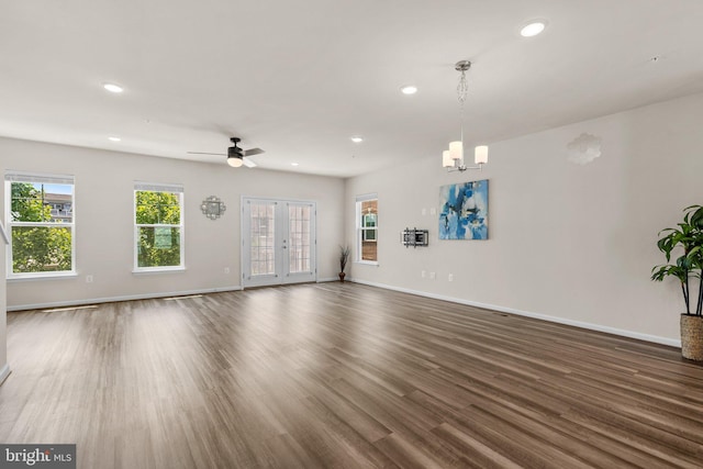 20318 Peacemaker Dr, Germantown, MD 20874 - unfurnished living room with recessed lighting, plenty of natural light, dark wood-type flooring, and a chandelier