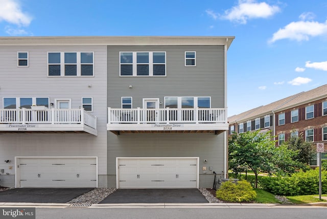20318 Peacemaker Dr, Germantown, MD 20874 - back of property with a garage and asphalt driveway