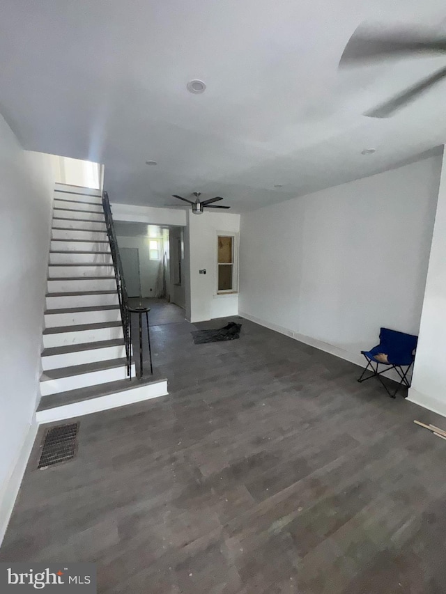 4335 N 15th St, Philadelphia, PA 19140 - unfurnished living room featuring a ceiling fan, stairs, and wood finished floors