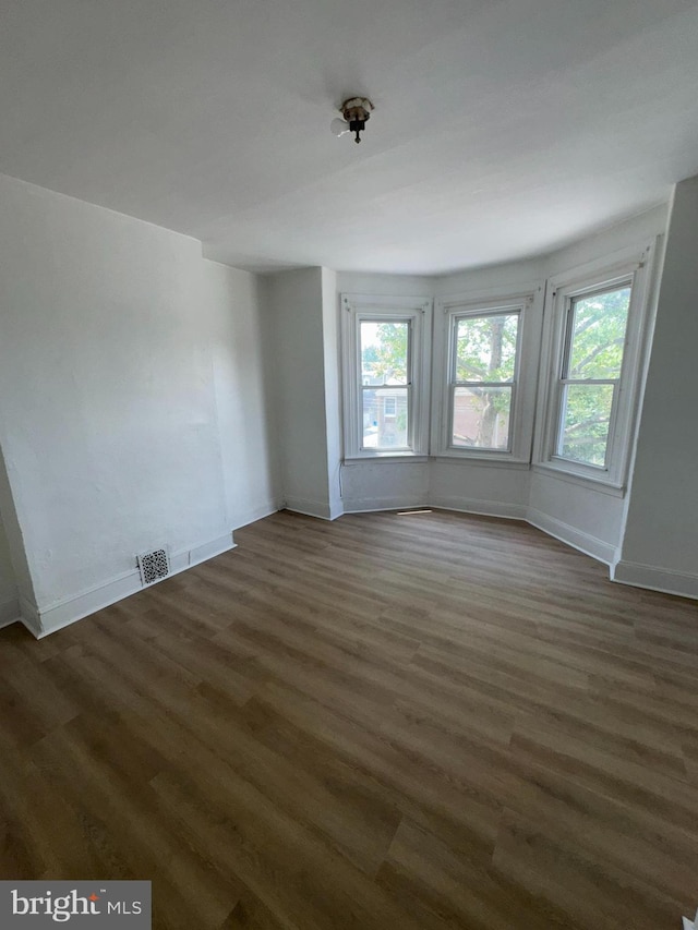 4335 N 15th St, Philadelphia, PA 19140 - unfurnished room featuring dark wood-style floors and baseboards