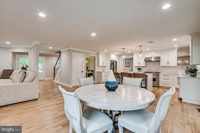 569 Riverside Dr, Princeton, NJ 08540 - dining room with stairway, recessed lighting, crown molding, and light wood-type flooring