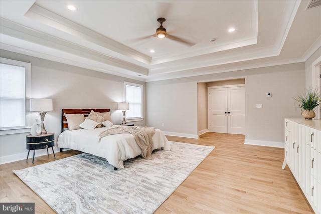 569 Riverside Dr, Princeton, NJ 08540 - bedroom featuring a tray ceiling, ornamental molding, light wood finished floors, recessed lighting, and ceiling fan