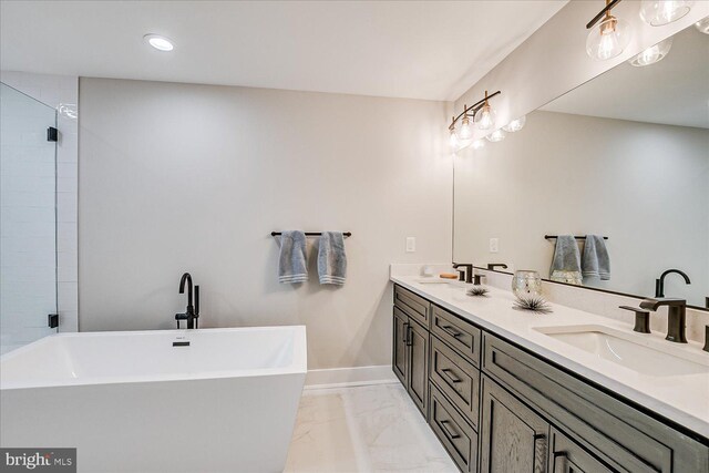569 Riverside Dr, Princeton, NJ 08540 - bathroom with marble look tile flooring, a freestanding tub, double vanity, and recessed lighting
