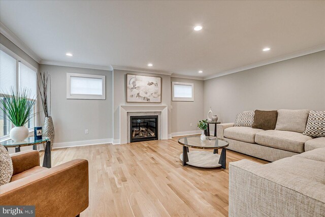 569 Riverside Dr, Princeton, NJ 08540 - living room with ornamental molding, light wood finished floors, recessed lighting, and a glass covered fireplace